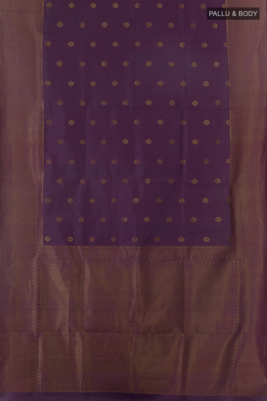 Flat view of Pure Silk Purple Soft Saree with Zari Butta on the body and Zari Border. 