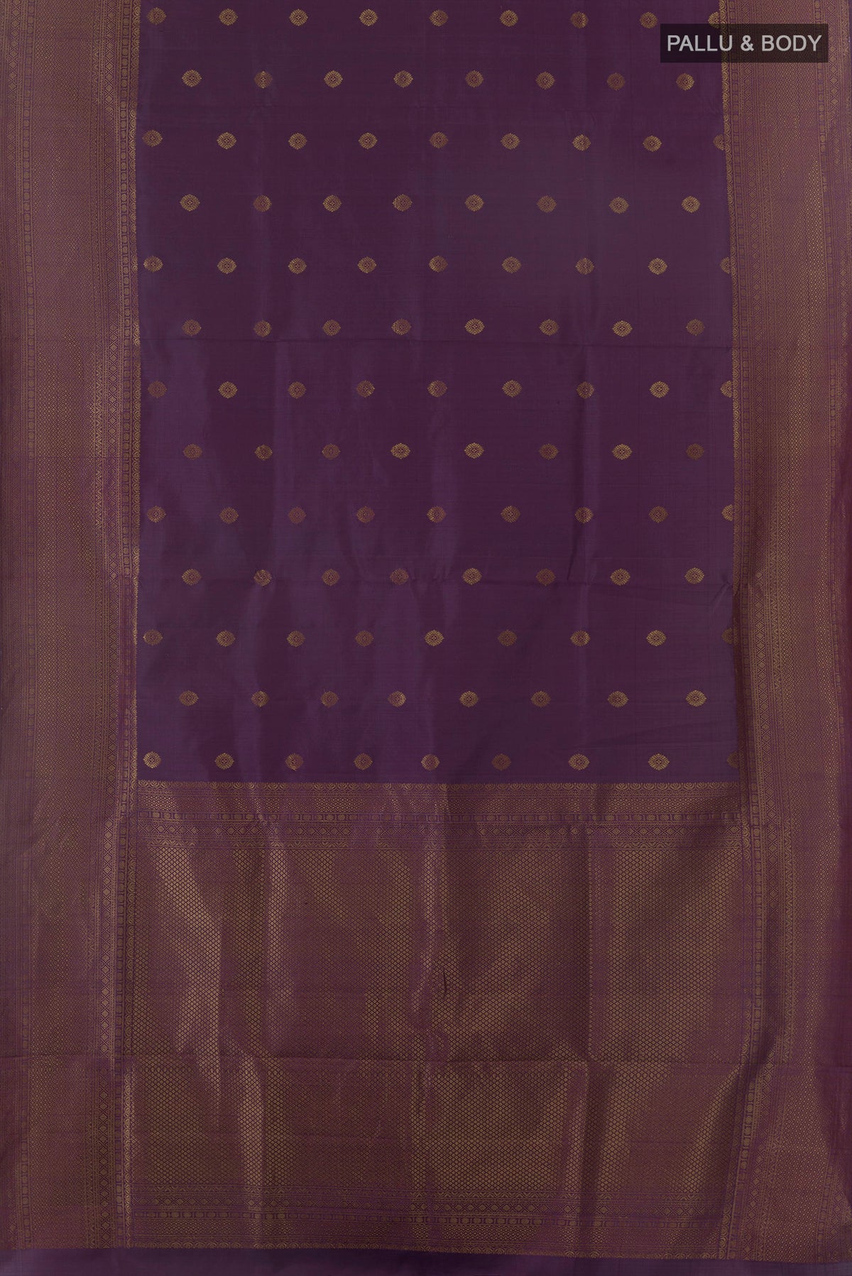 Flat view of Pure Silk Purple Soft Saree with Zari Butta on the body and Zari Border. 