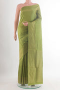 Pure Silk Green Soft Saree with Zari Butta on the body and Zari Border.  displayed on a mannequin