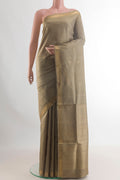 Pure Silk Dark Beige Soft Saree with Zari Butta on the body and Zari Border.  displayed on a mannequin