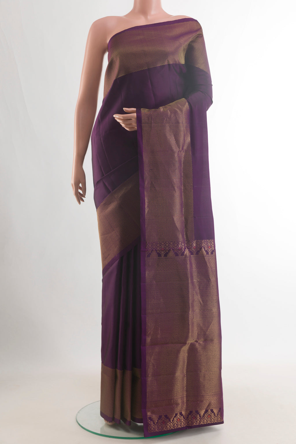 Pure Silk Purple Soft Saree with Plain Body and Zari Border.  displayed on a mannequin
