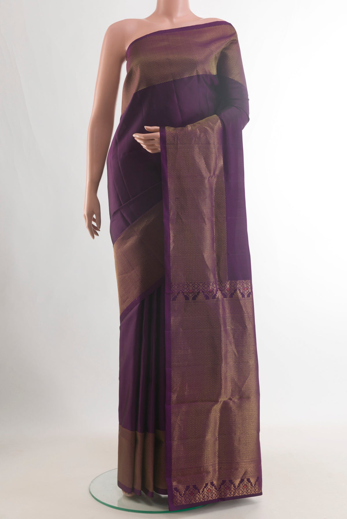 Pure Silk Purple Soft Saree with Plain Body and Zari Border.  displayed on a mannequin
