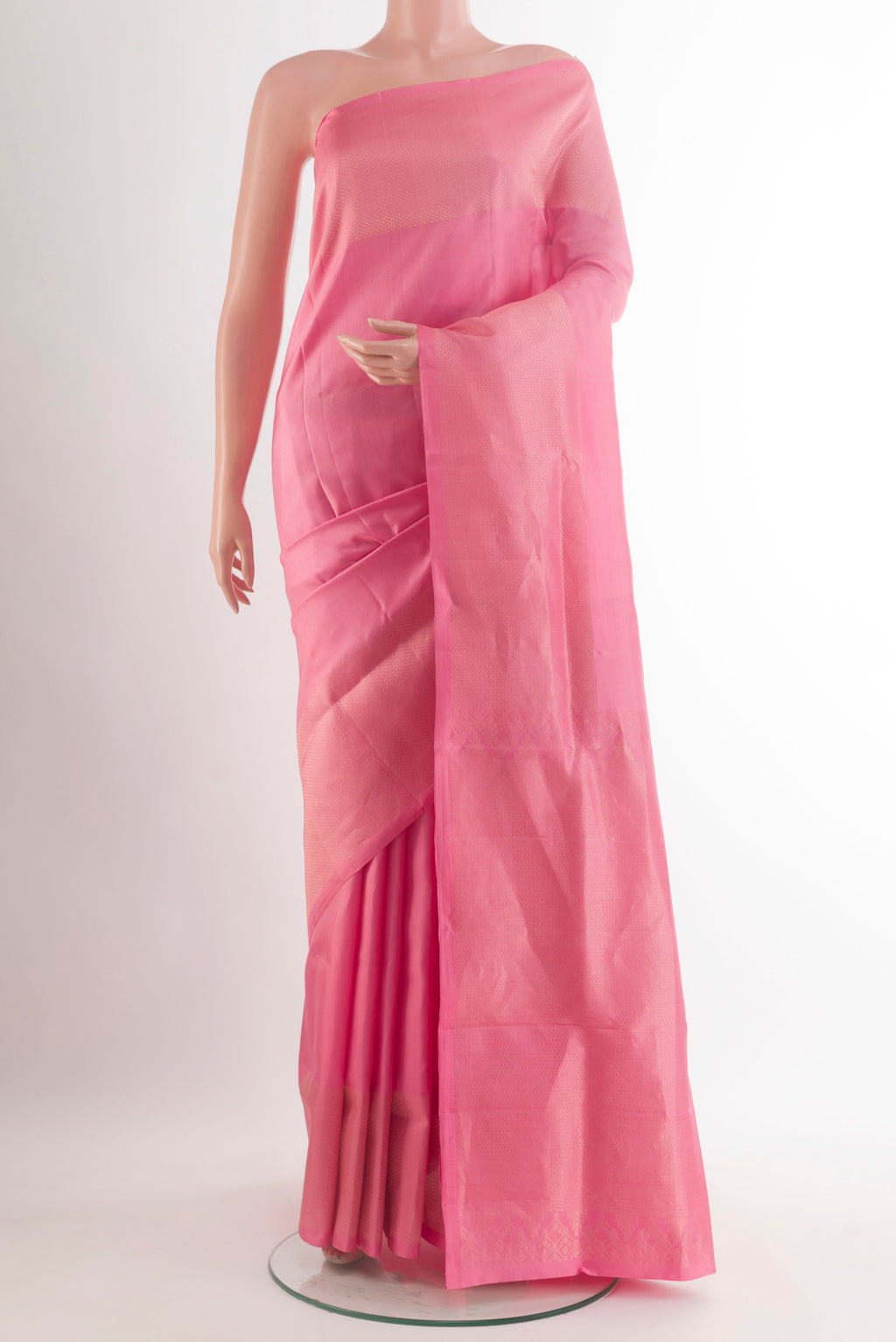 Pure Silk Pink Soft Saree with Plain Body and Zari Border.  displayed on a mannequin