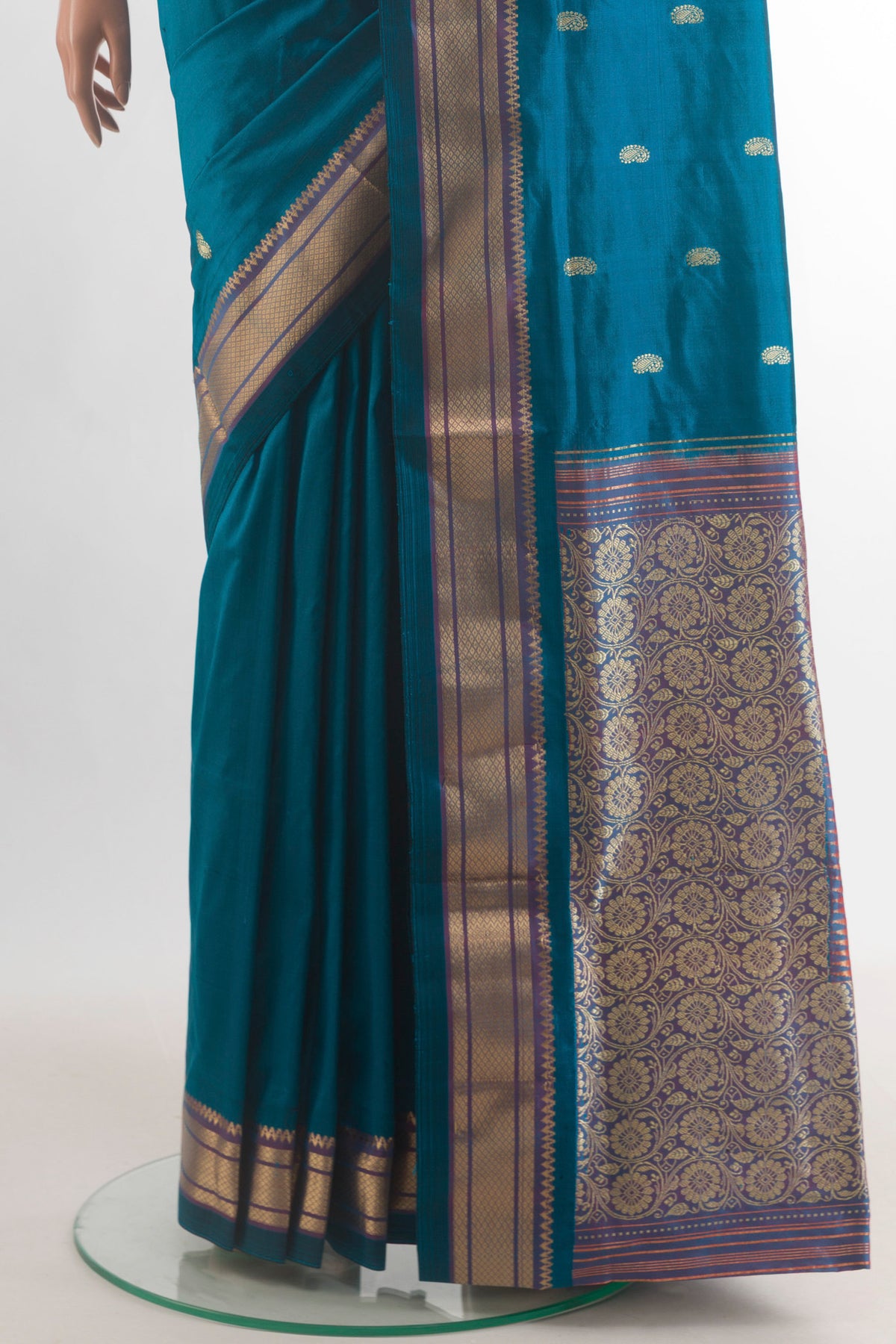 Pleats and pallu of Pure Silk Peacock Blue Paithani Saree with Zari Butta on the body and Zari Border. 
