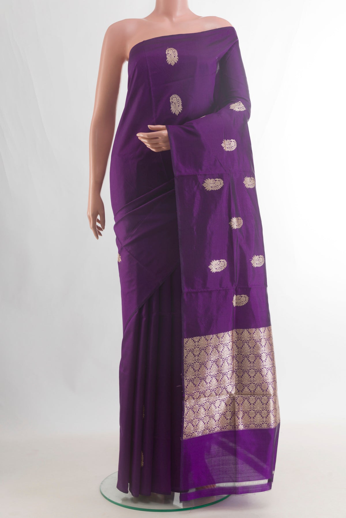 Pure Silk Purple Banarasi Katan Saree with Zari Butta on the body and Without Border.  displayed on a mannequin