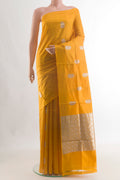 Pure Silk Yellow Banarasi Katan Saree with Zari Butta on the body and Without Border.  displayed on a mannequin