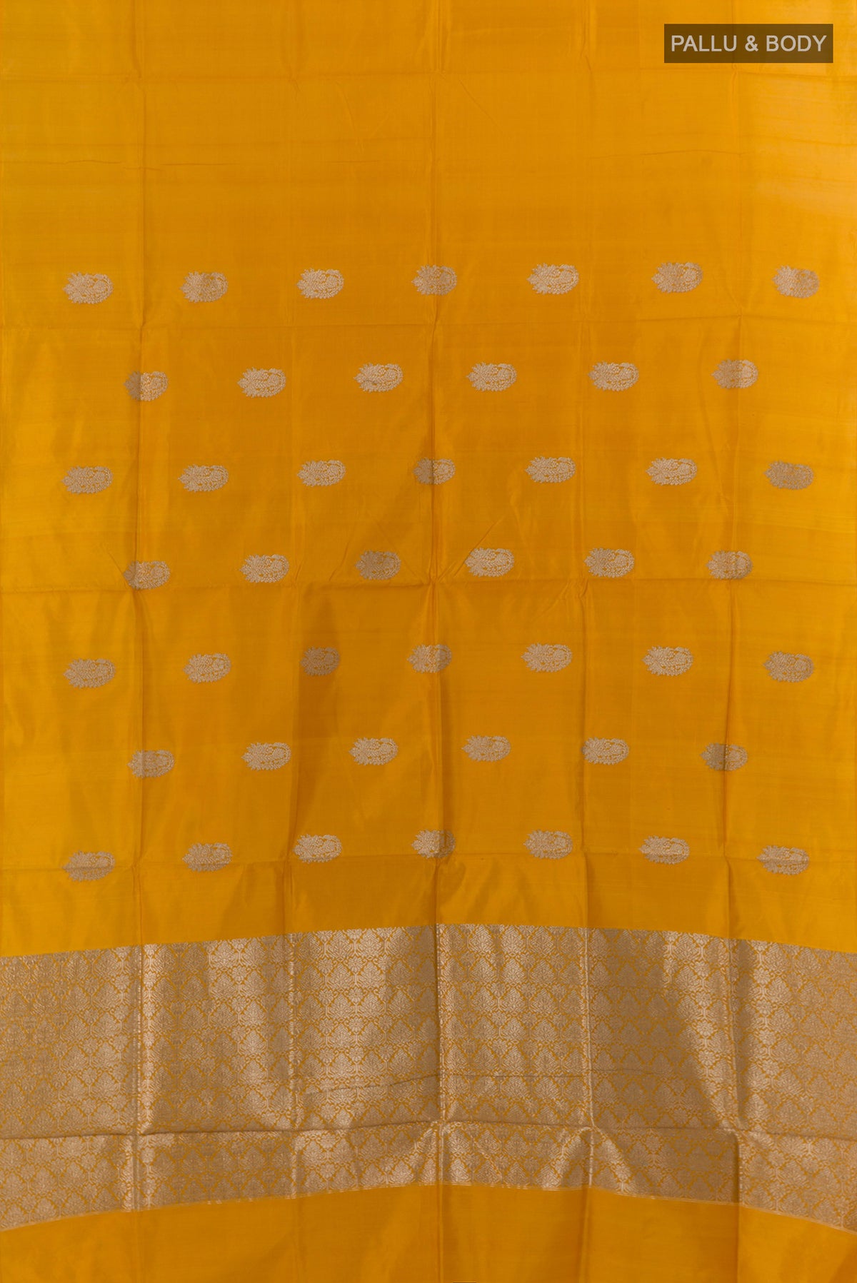Flat view of Pure Silk Yellow Banarasi Katan Saree with Zari Butta on the body and Without Border. 