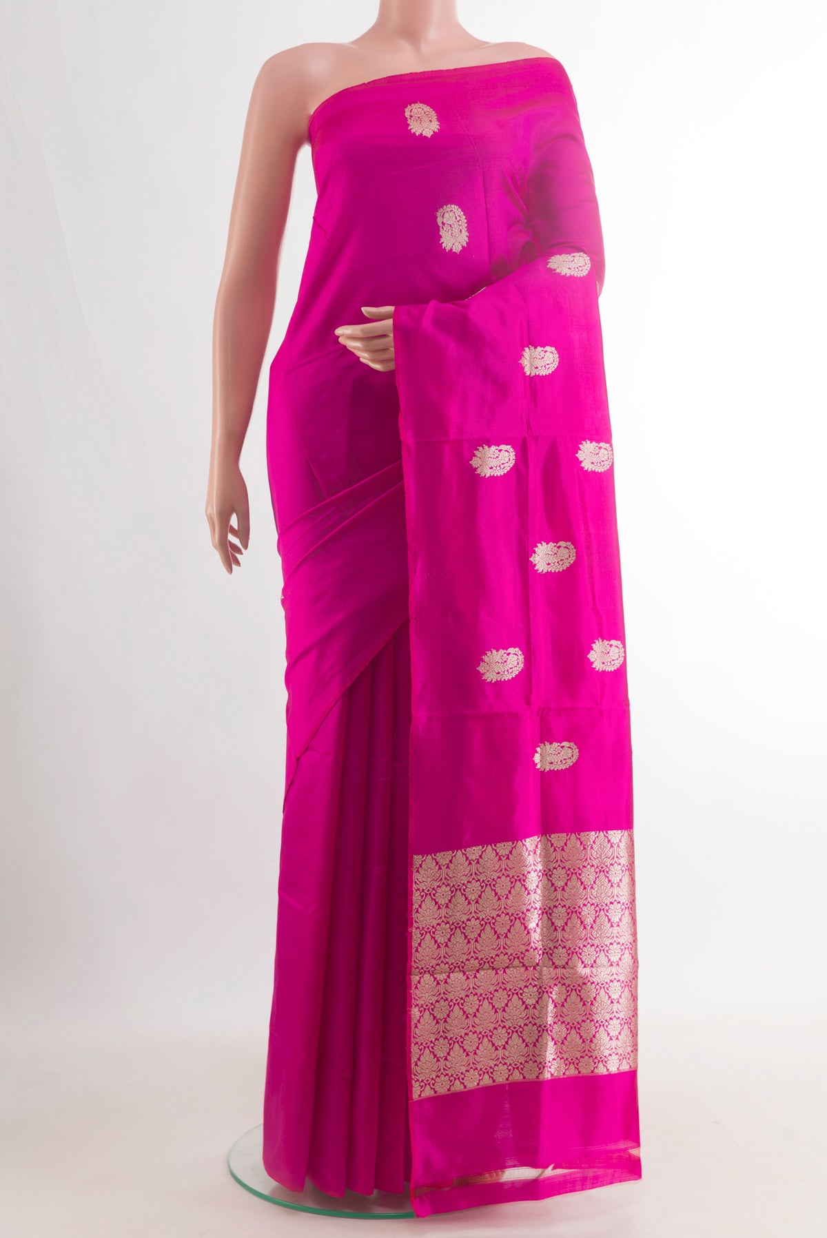Pure Silk Pink Banarasi Katan Saree with Zari Butta on the body and Without Border.  displayed on a mannequin