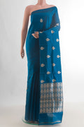 Pure Silk Peacock Blue Banarasi Katan Saree with Zari Butta on the body and Without Border.  displayed on a mannequin
