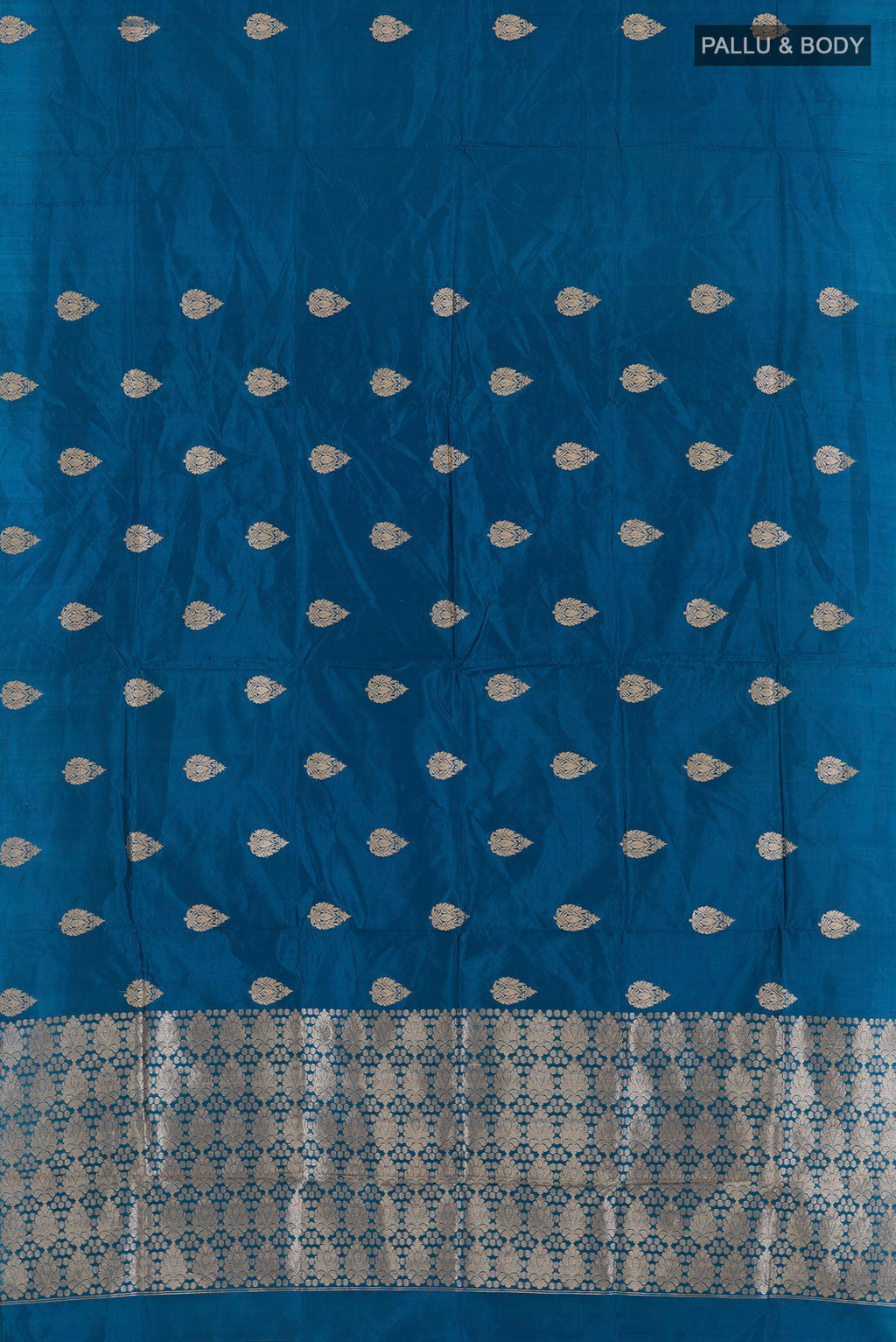 Flat view of Pure Silk Peacock Blue Banarasi Katan Saree with Zari Butta on the body and Without Border. 