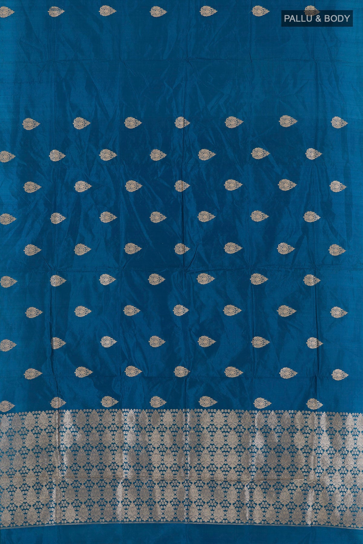 Flat view of Pure Silk Peacock Blue Banarasi Katan Saree with Zari Butta on the body and Without Border. 