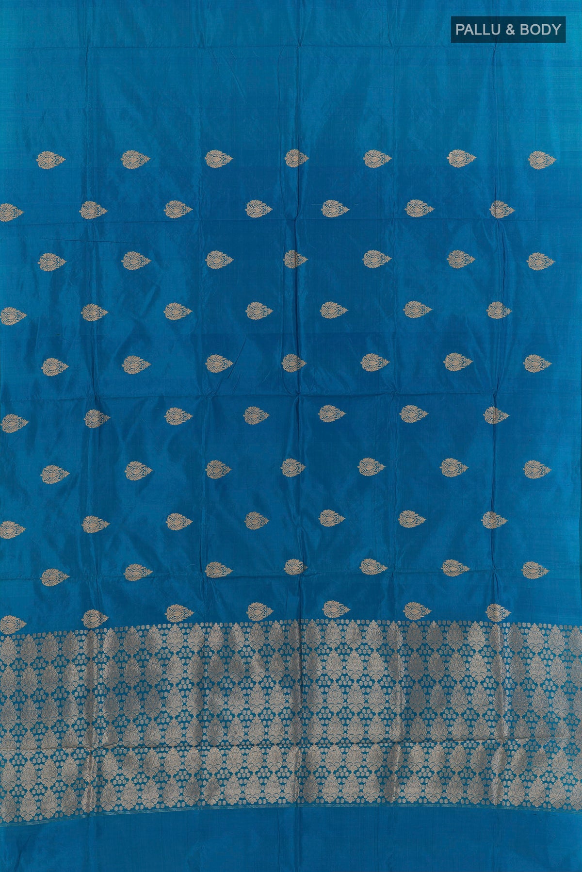 Flat view of Pure Silk Blue Banarasi Katan Saree with Zari Butta on the body and Without Border. 