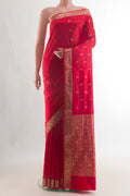 Pure Silk Red Banarasi Katan Saree with Zari Butta on the body and Zari Border.  displayed on a mannequin