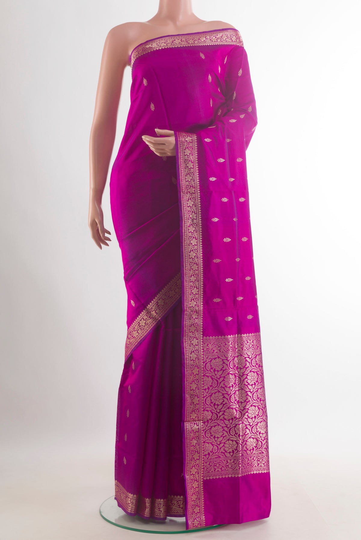 Pure Silk Magenta Banarasi Katan Saree with Zari Butta on the body and Zari Border.  displayed on a mannequin