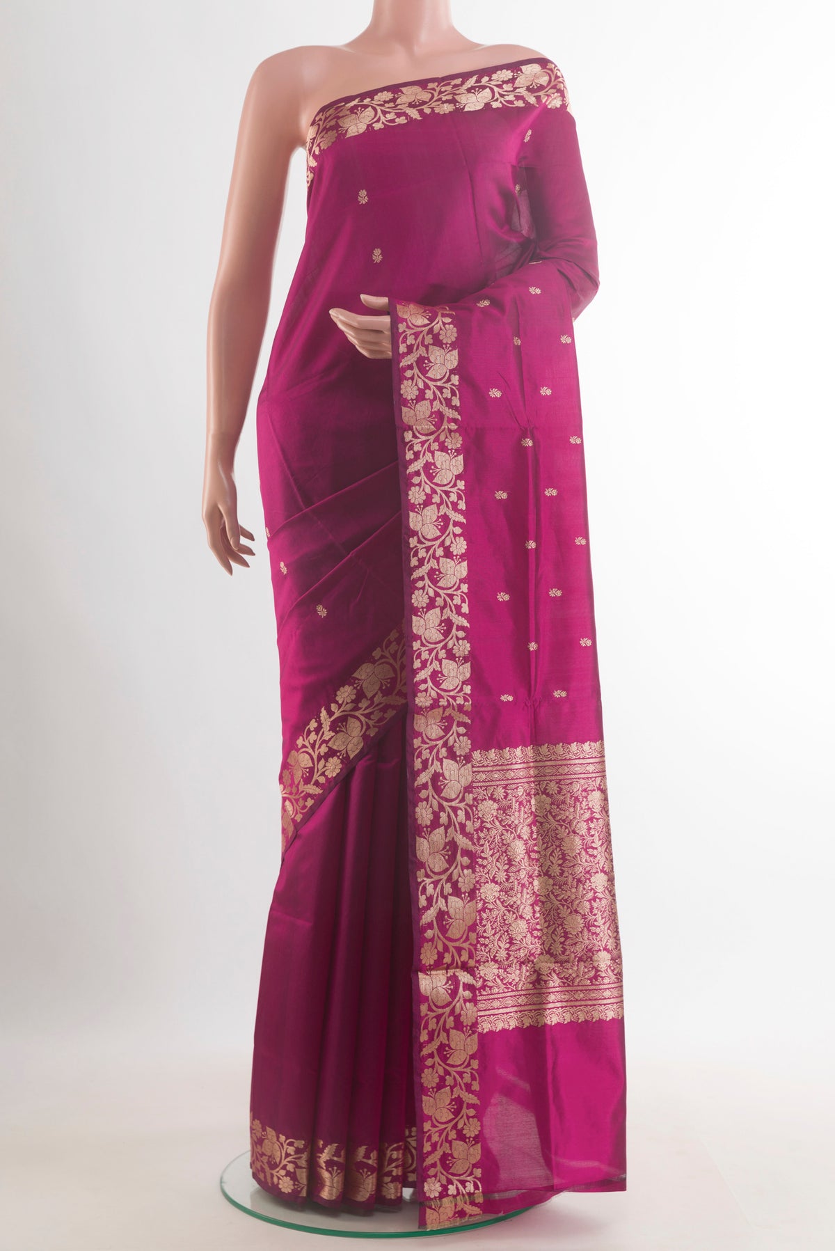 Pure Silk Magenta Banarasi Katan Saree with Zari Butta on the body and Zari Border.  displayed on a mannequin