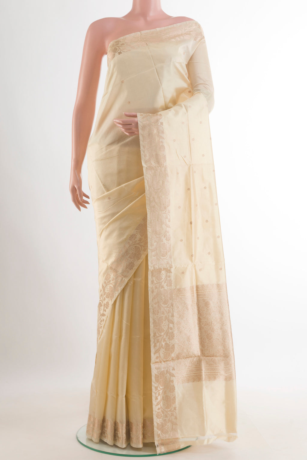 Pure Silk Off White Banarasi Katan Saree with Zari Butta on the body and Zari Border.  displayed on a mannequin