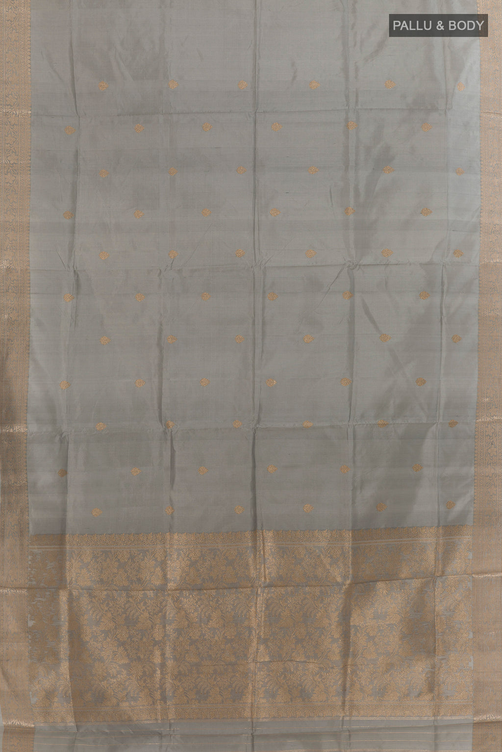 Flat view of Pure Silk Grey Banarasi Katan Saree with Zari Butta on the body and Zari Border. 