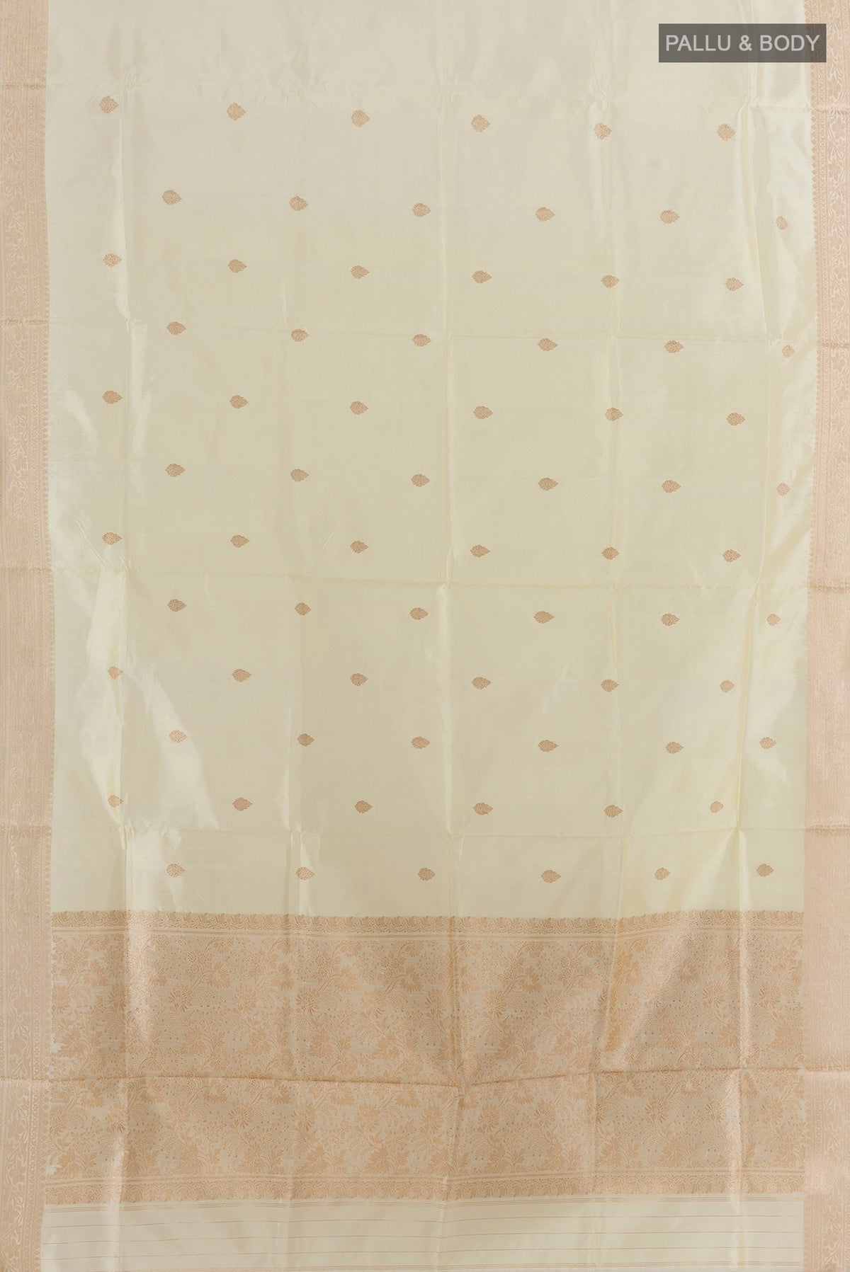 Flat view of Pure Silk Off White Banarasi Katan Saree with Zari Butta on the body and Zari Border. 