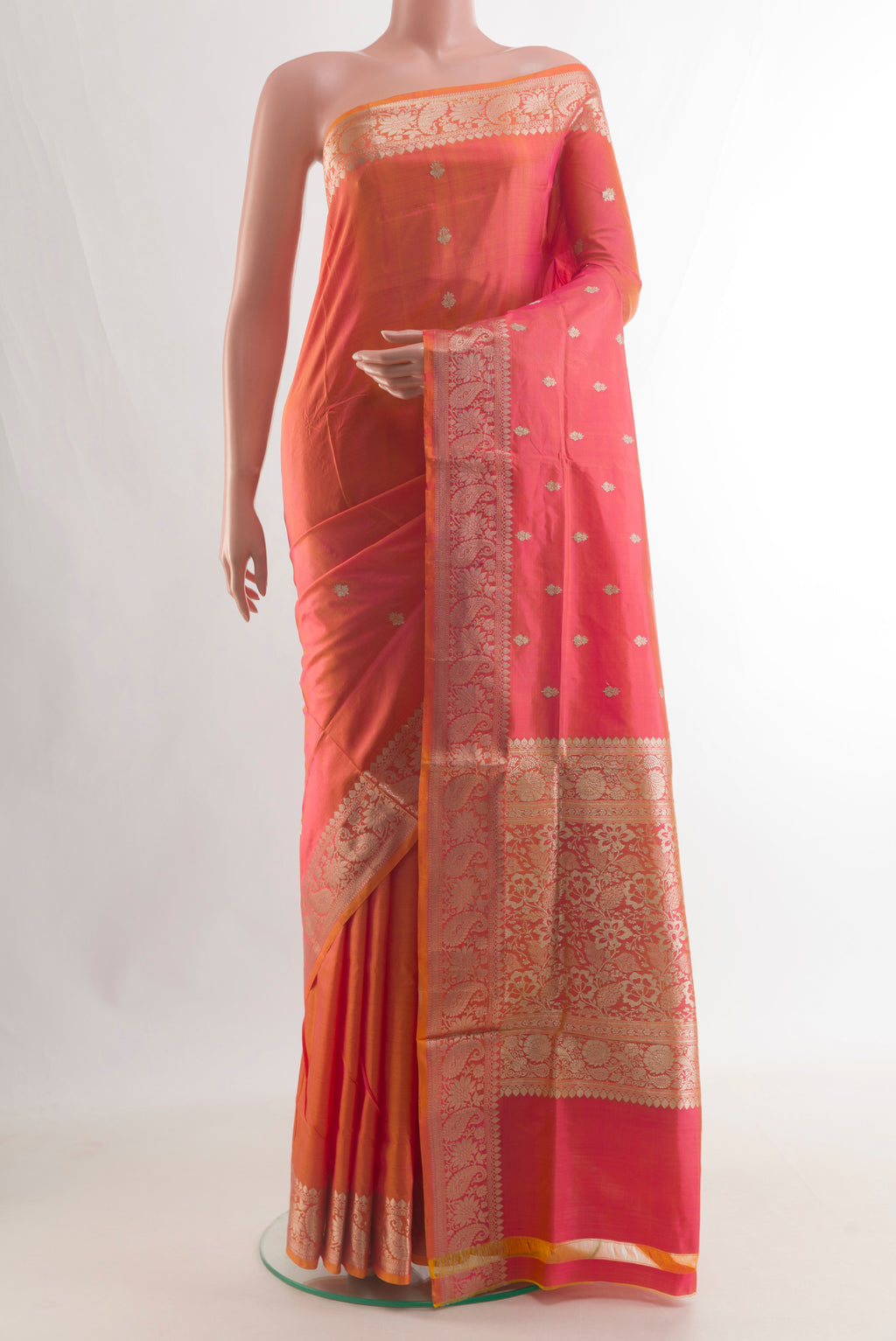 Pure Silk Orange Banarasi Katan Saree with Zari Butta on the body and Zari Border.  displayed on a mannequin