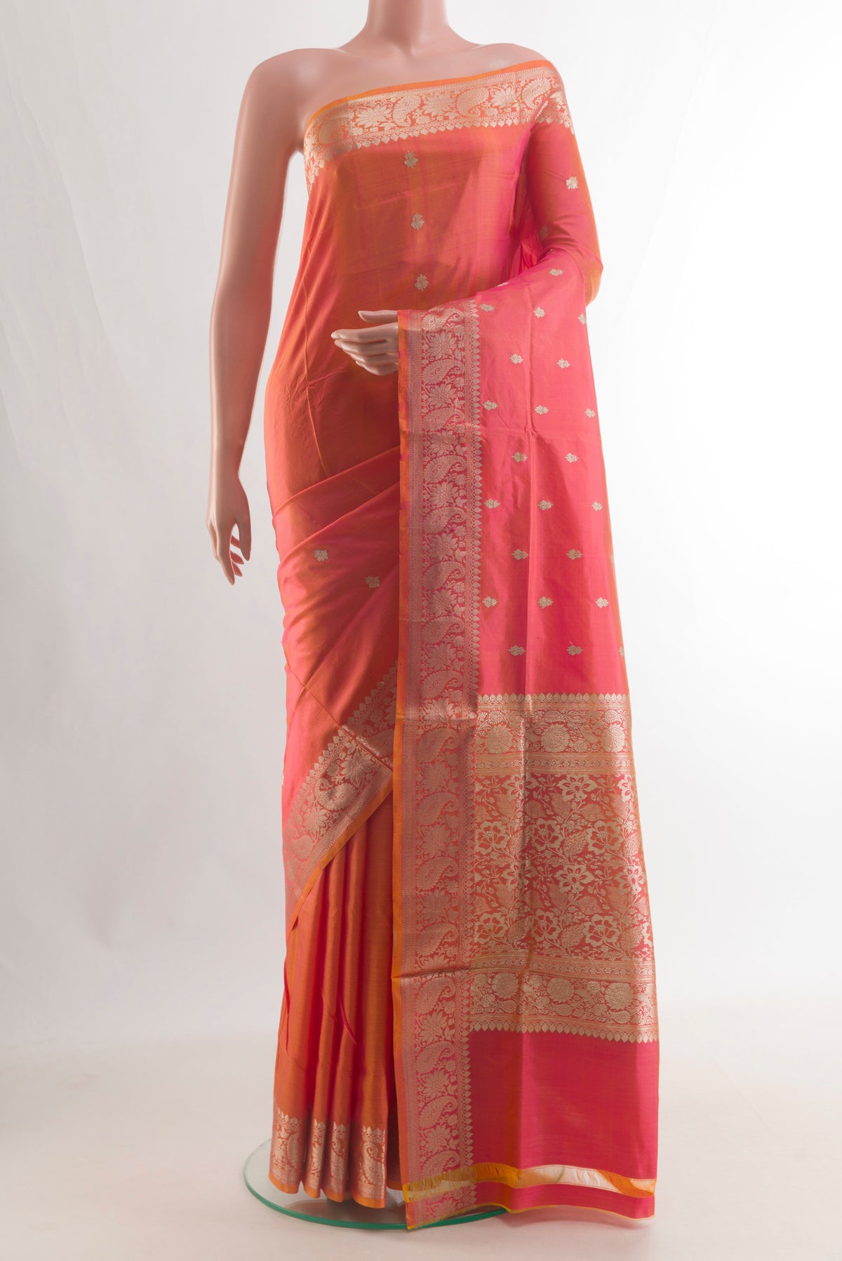 Pure Silk Orange Banarasi Katan Saree with Zari Butta on the body and Zari Border.  displayed on a mannequin