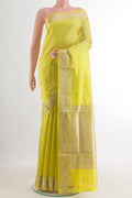 Pure Silk Lemon Yellow Banarasi Katan Saree with Zari Butta on the body and Zari Border.  displayed on a mannequin