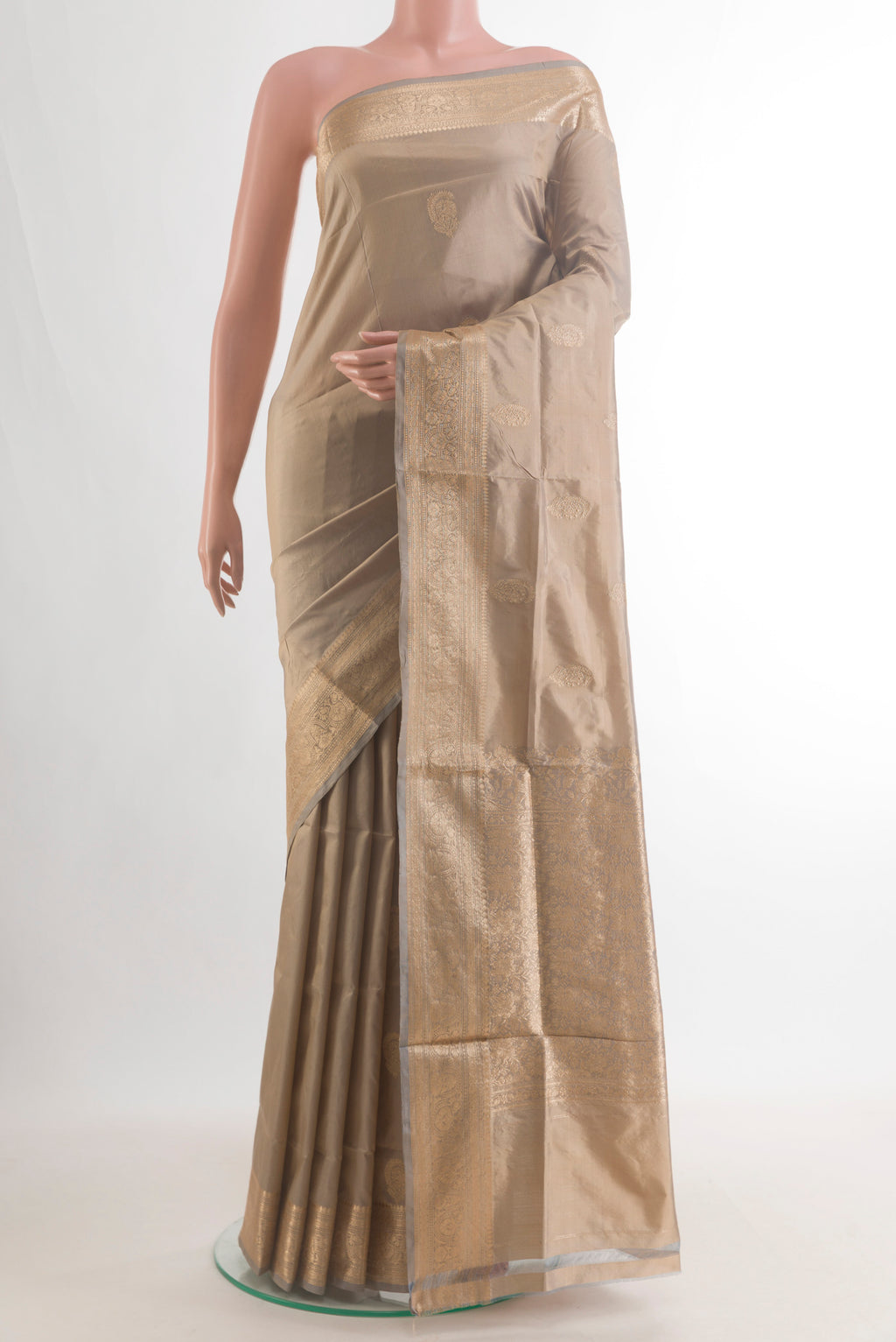 Pure Silk Dark Beige Banarasi Katan Saree with Zari Butta on the body and Zari Border.  displayed on a mannequin