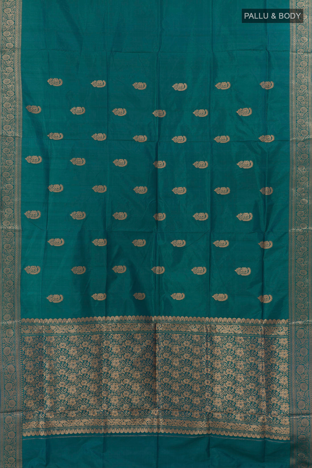 Flat view of Pure Silk Peacock Blue Dual Tone Banarasi Katan Saree with Zari Butta on the body and Zari Border. 