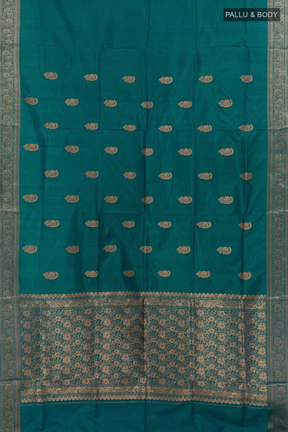 Flat view of Pure Silk Peacock Blue Dual Tone Banarasi Katan Saree with Zari Butta on the body and Zari Border. 