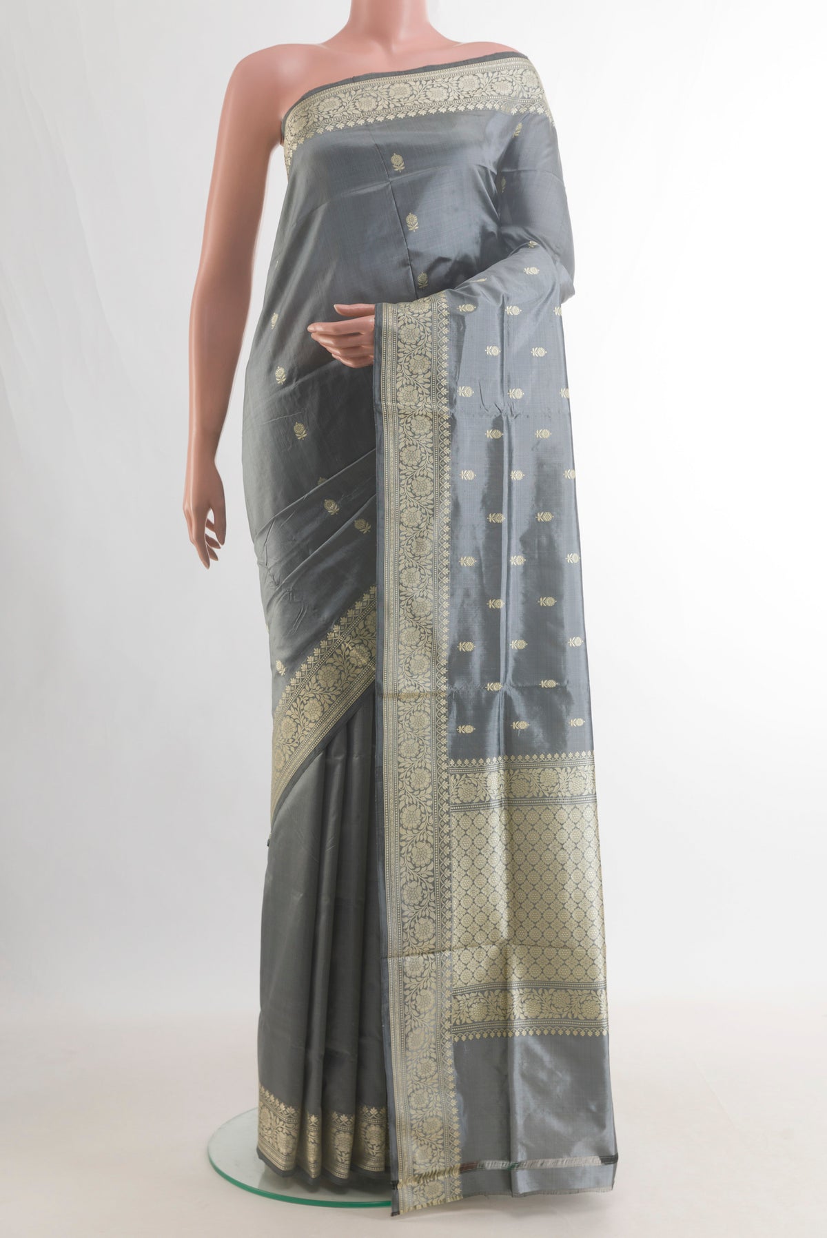Pure Silk Grey Banarasi Katan Saree with Thread Butta on the body and Thread Border.  displayed on a mannequin