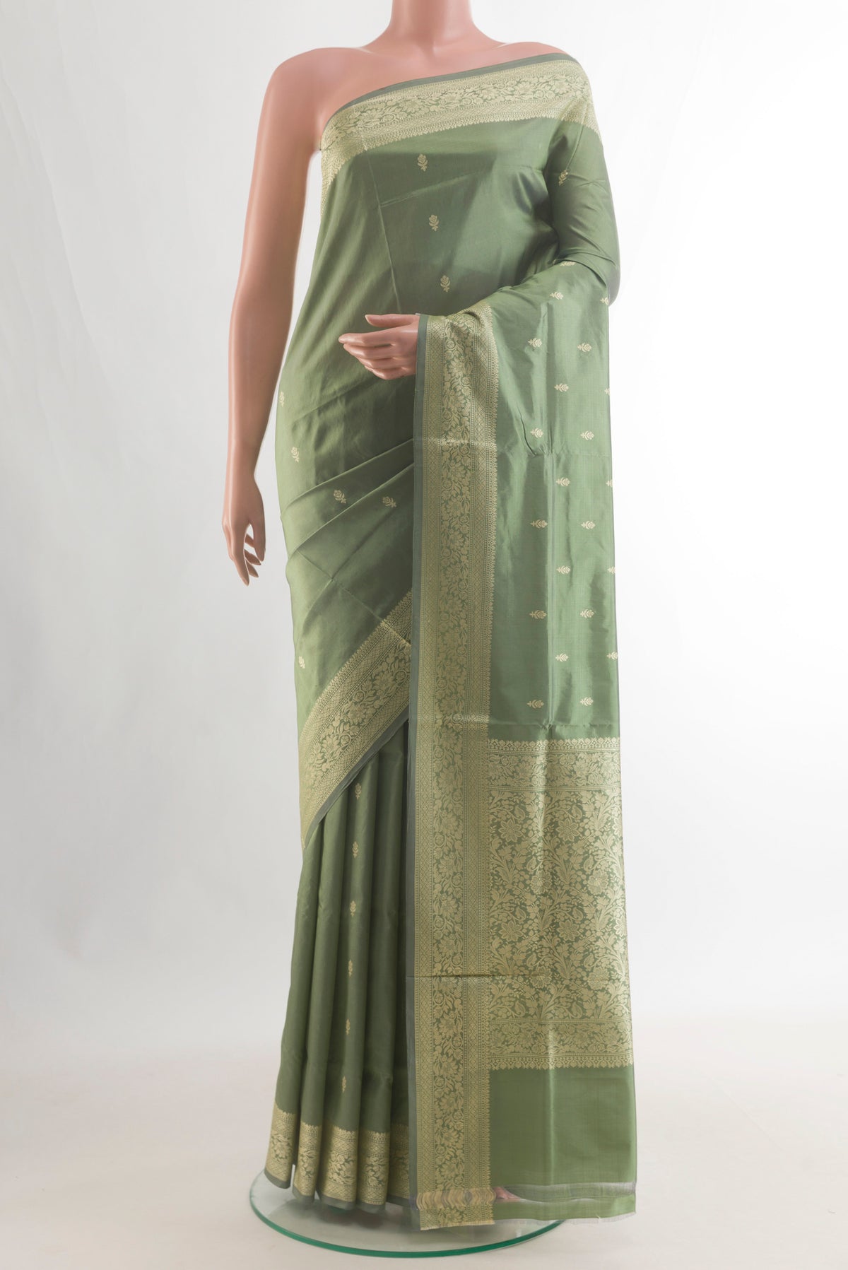 Pure Silk Green Banarasi Katan Saree with Zari Butta on the body and Zari Border.  displayed on a mannequin