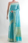 Pure Silk Turquoise Banarasi Katan Saree with Thread Butta on the body and Thread Border.  displayed on a mannequin