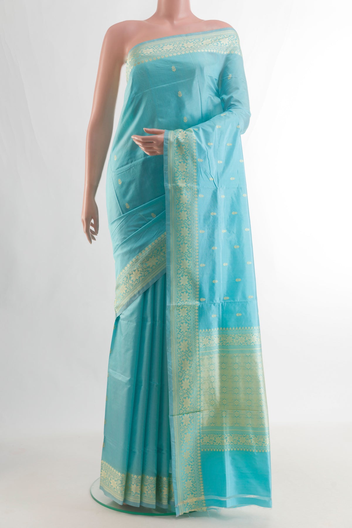 Pure Silk Turquoise Banarasi Katan Saree with Thread Butta on the body and Thread Border.  displayed on a mannequin
