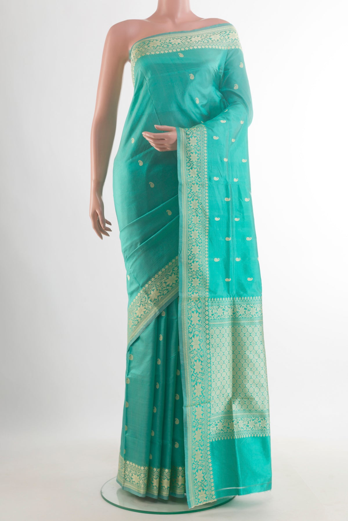 Pure Silk Sea Green Banarasi Katan Saree with Thread Butta on the body and Thread Border.  displayed on a mannequin