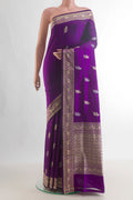 Pure Silk Purple Banarasi Katan Saree with Thread Butta on the body and Thread Border.  displayed on a mannequin