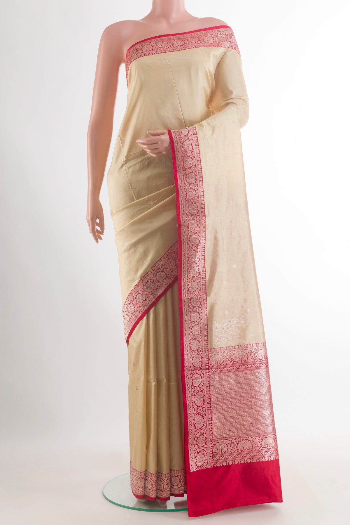 Pure Silk Cream Banarasi Katan Saree with Zari Butta on the body and Zari Border.  displayed on a mannequin