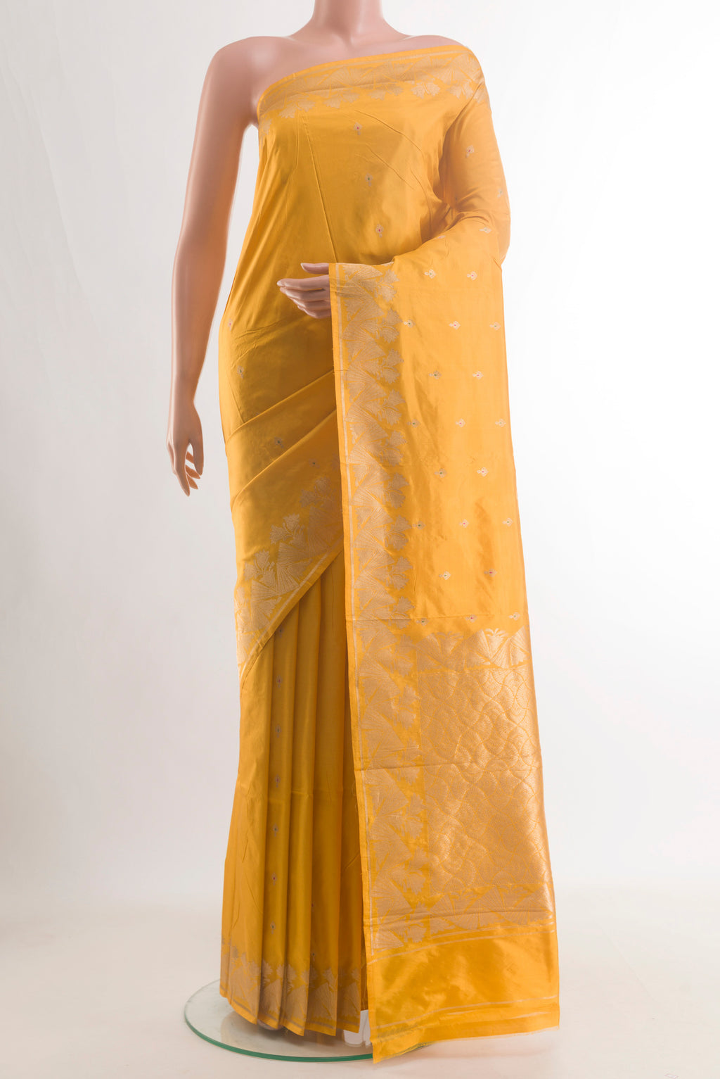 Pure Silk Yellow Banarasi Katan Saree with Zari Butta on the body and Zari Border.  displayed on a mannequin