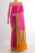 Pure Silk Pink Banarasi Katan Saree with Zari Butta on the body and Zari Border.  displayed on a mannequin