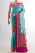 Pure Silk Blue Banarasi Katan Saree with Zari Butta on the body and Zari Border.  displayed on a mannequin