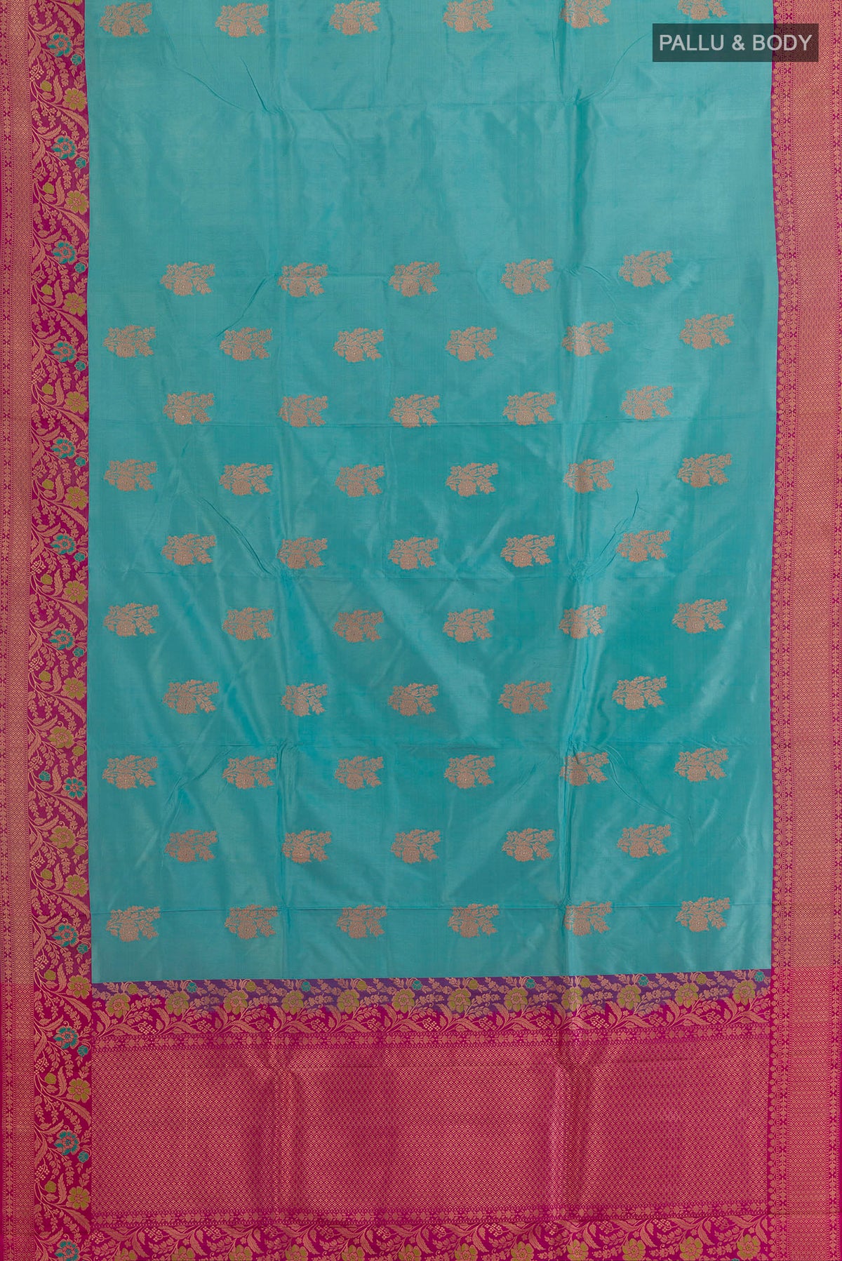 Flat view of Pure Silk Blue Banarasi Katan Saree with Zari Butta on the body and Zari Border. 