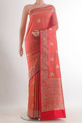 Pure Silk Orange Banarasi Katan Saree with Zari Butta on the body and Zari Border.  displayed on a mannequin