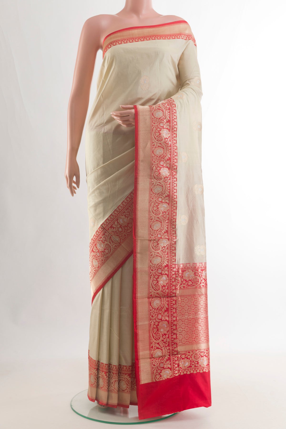 Pure Silk Off White Banarasi Katan Saree with Zari Butta on the body and Zari Border.  displayed on a mannequin