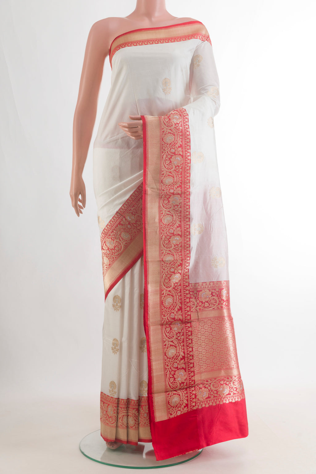 Pure Silk Off White Banarasi Katan Saree with Zari Butta on the body and Zari Border.  displayed on a mannequin