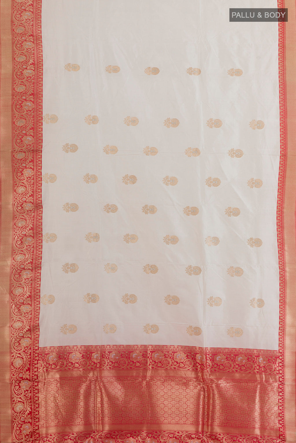 Flat view of Pure Silk Off White Banarasi Katan Saree with Zari Butta on the body and Zari Border. 