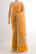 Pure Silk Yellow Banarasi Saree with Zari Brocade on the body and Zari Border.  displayed on a mannequin