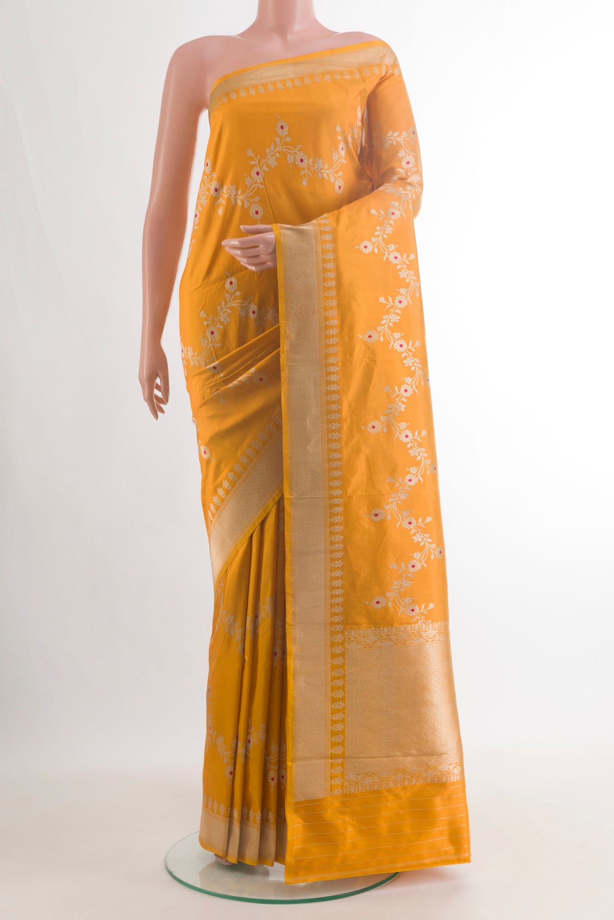 Pure Silk Yellow Banarasi Saree with Zari Brocade on the body and Zari Border.  displayed on a mannequin