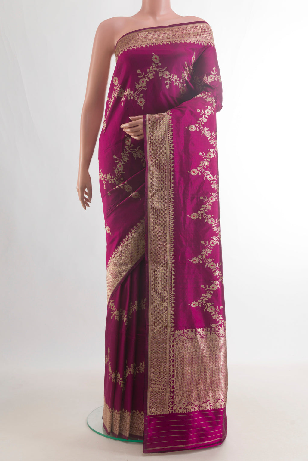 Pure Silk Magenta Banarasi Saree with Zari Brocade on the body and Zari Border.  displayed on a mannequin