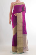 Pure Silk Magenta Banarasi Katan Saree with Zari Butta on the body and Zari Border.  displayed on a mannequin