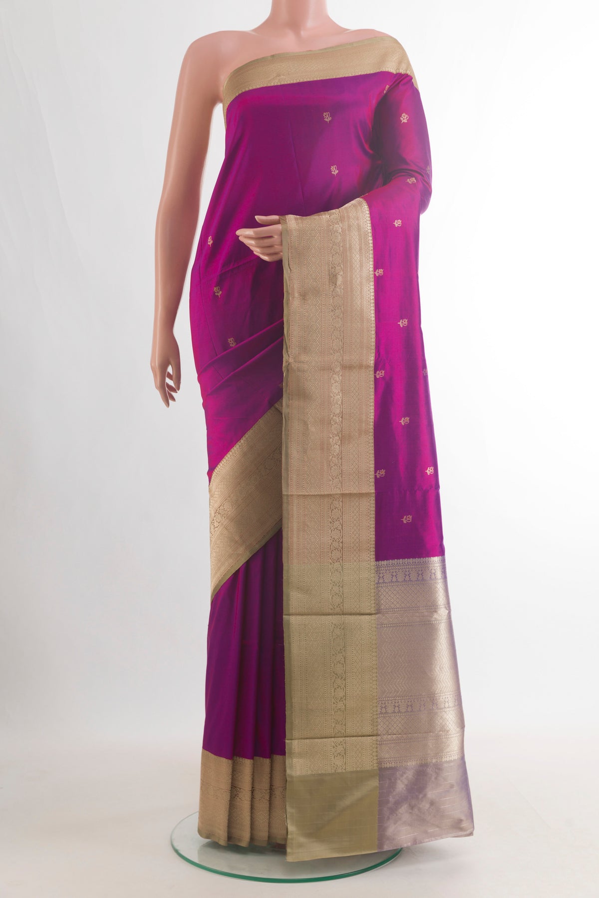 Pure Silk Magenta Banarasi Katan Saree with Zari Butta on the body and Zari Border.  displayed on a mannequin