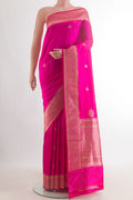 Pure Silk Pink Banarasi Katan Saree with Zari Butta on the body and Zari Border.  displayed on a mannequin