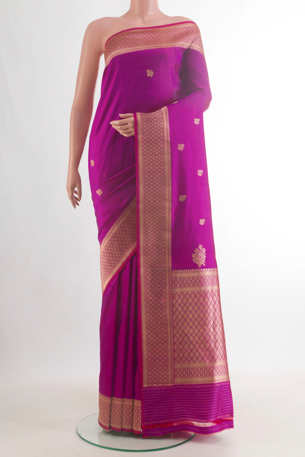 Pure Silk Magenta Banarasi Katan Saree with Zari Butta on the body and Zari Border.  displayed on a mannequin